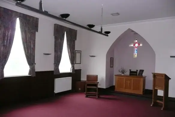 A small room with a wooden stand